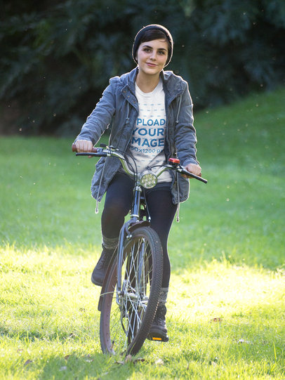 Woman Wearing a Tshirt Template Riding her Bike Outdoors