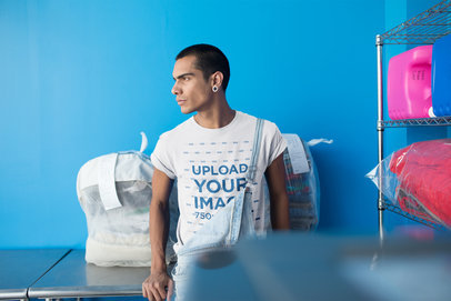 Serious Short-Haired Man Wearing a Round Neck Tee Mockup at the Laundry 