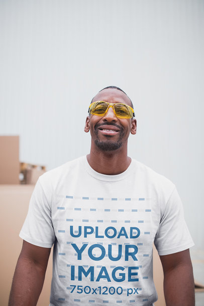Smiling Warehouse Worker Wearing Safety Goggles and a T-Shirt Mockup