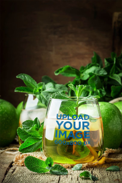 Stemless Wine Glass Mockup Featuring an Apple Drink with Mint Leaves 36698-r-el2